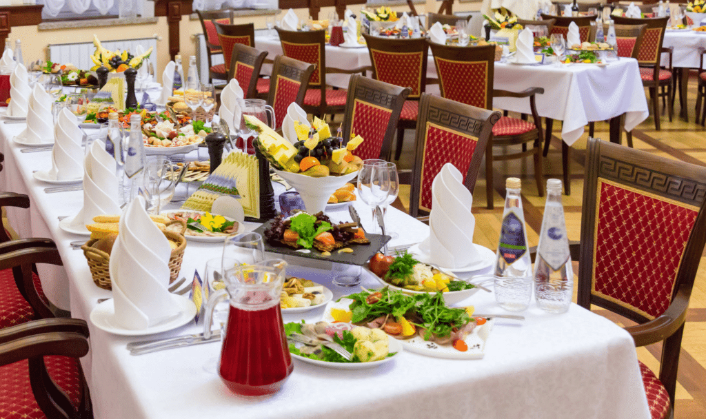 a dining table set with a spread of dishes 