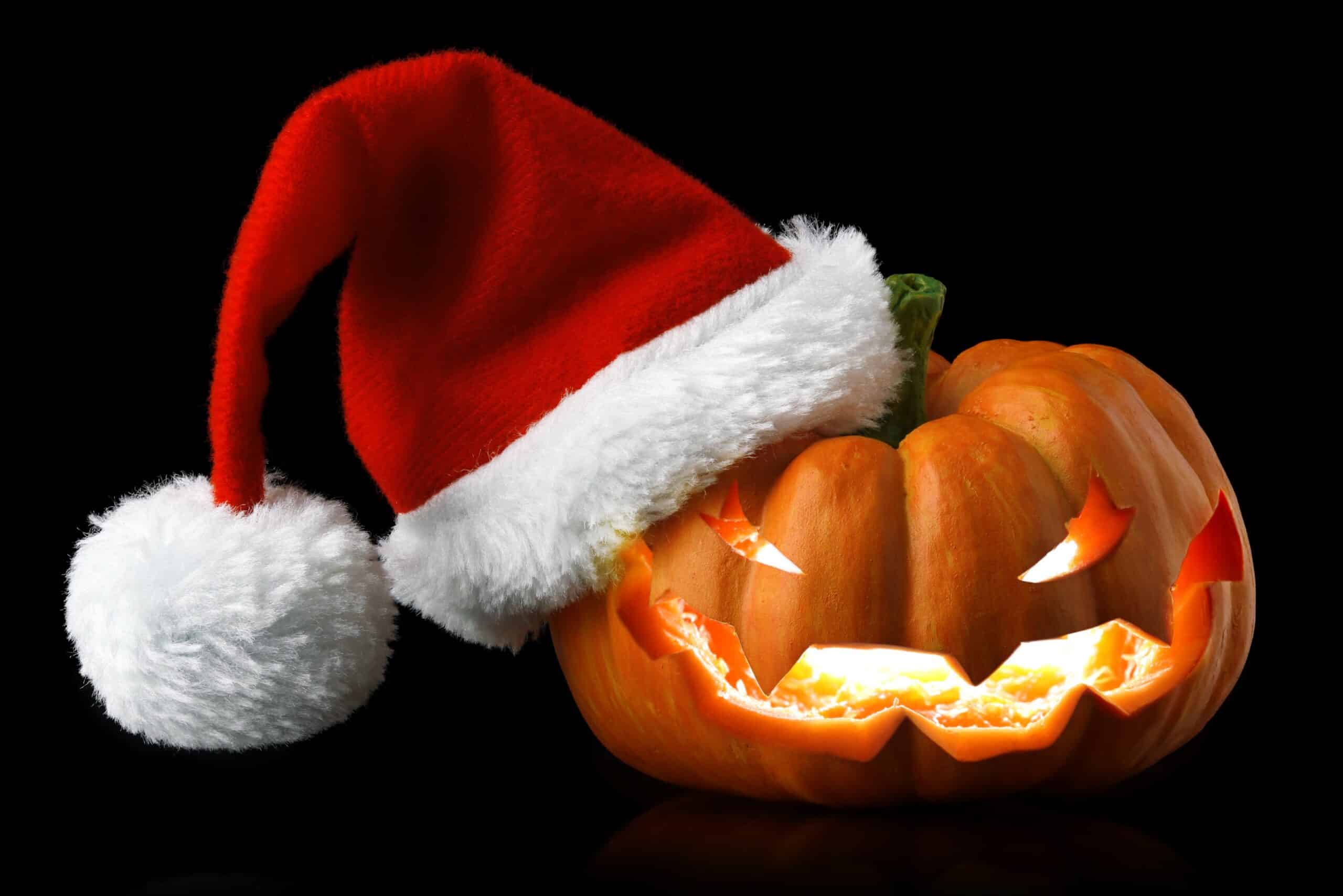 a pumpkin with a santa hat on it