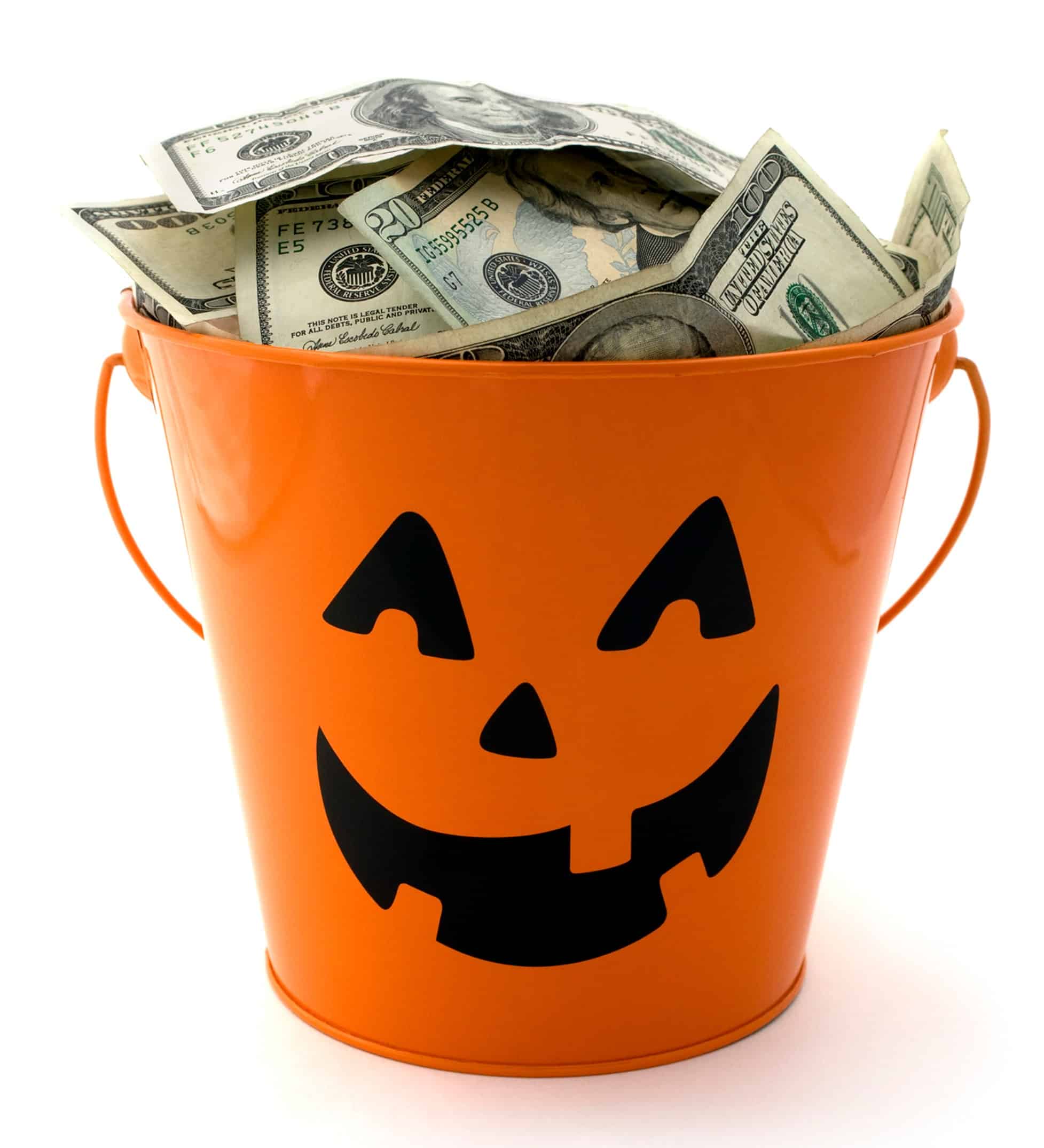 an orange halloween bucket filled with cash