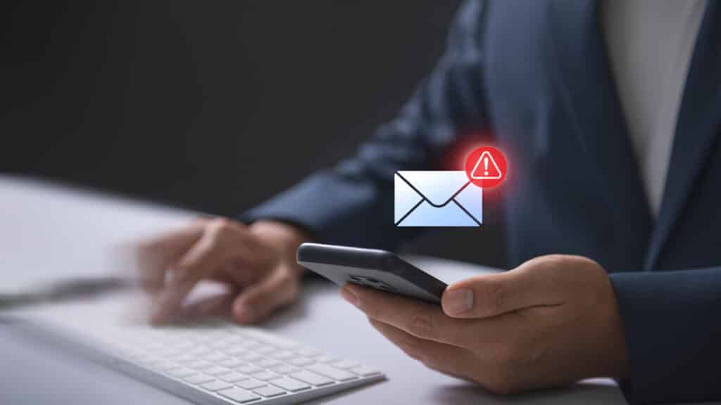 Email hacked warning alert notification of scam malware spreading virus on message alert virtual on smartphone